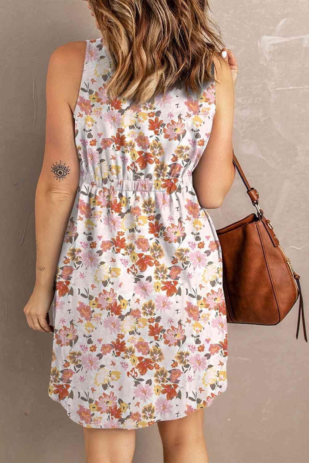 a woman in a floral dress is holding a purse