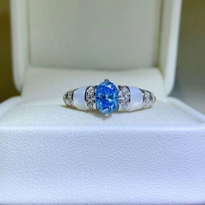 a blue and white ring in a white box
