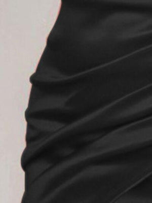 a close up of a woman's black skirt