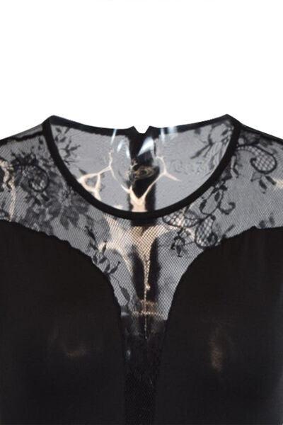 a woman's top with a black and white design on it