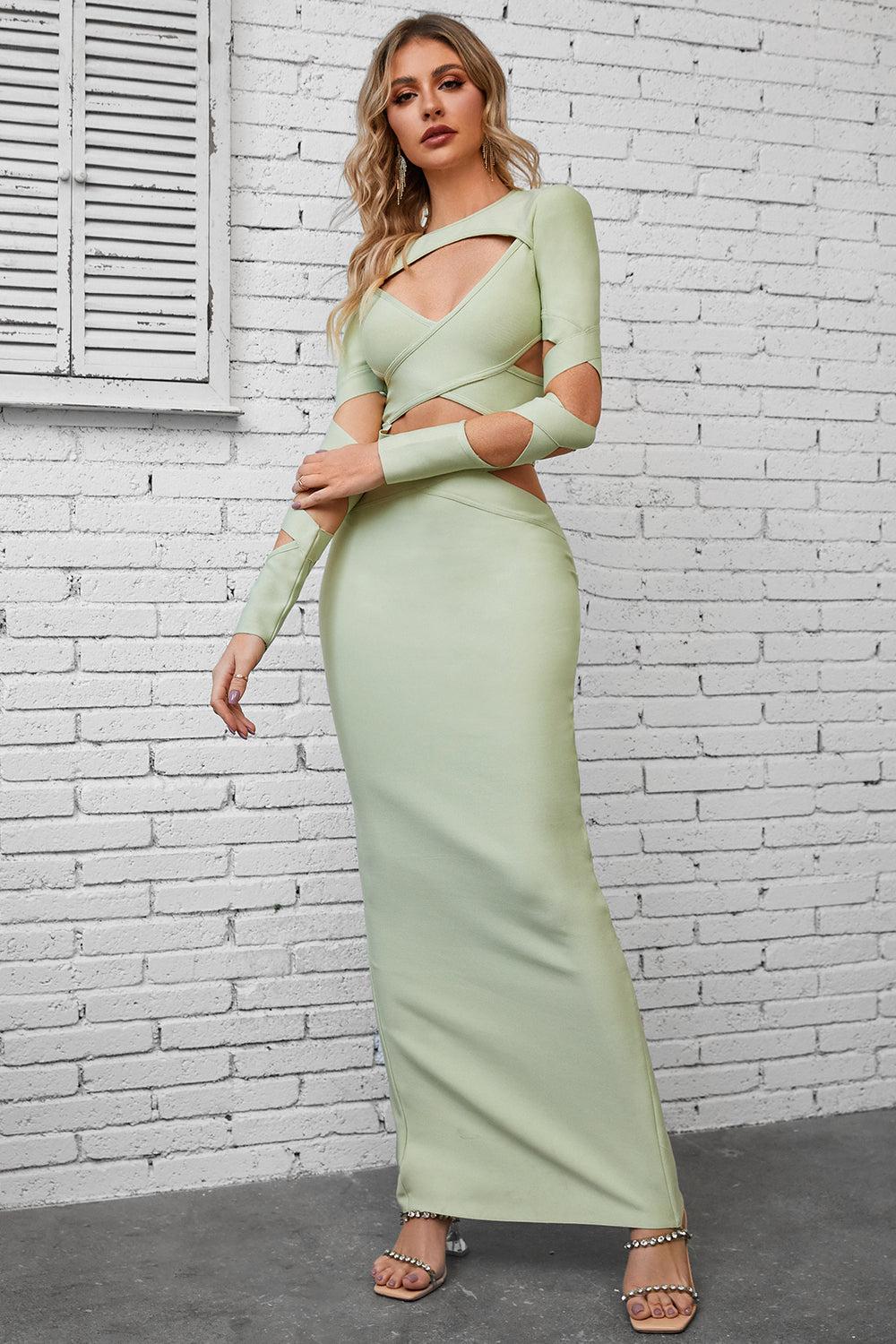 a woman in a green dress posing for a picture