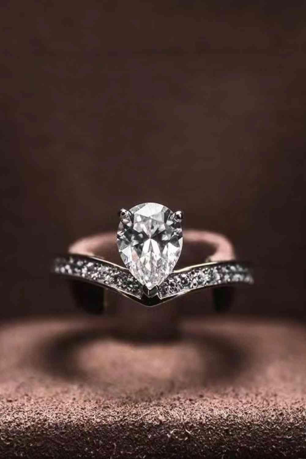 a ring with a diamond on top of it