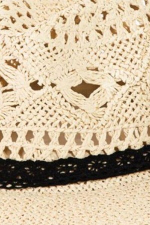 a close up of a hat with a black ribbon