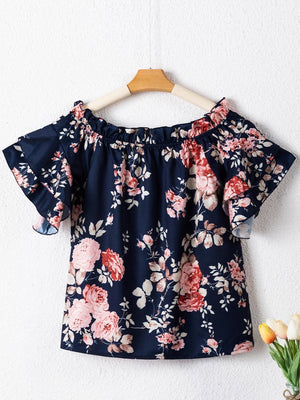 a blue top with pink flowers on it