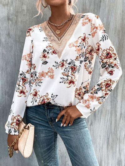 a woman wearing a white blouse and jeans