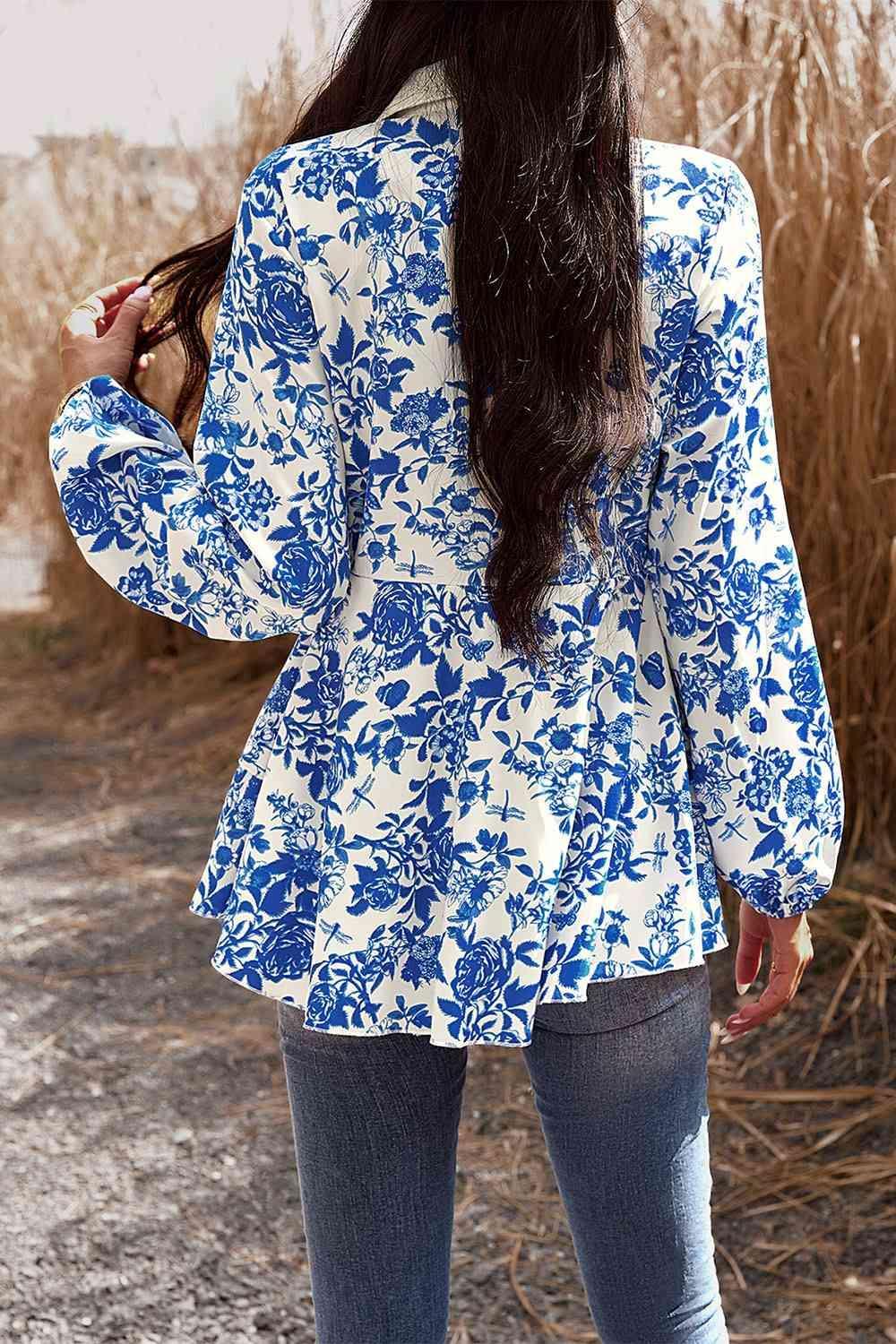 a woman with long hair wearing a blue and white jacket