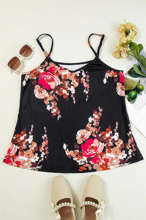 a black top with a floral print and a pair of sandals