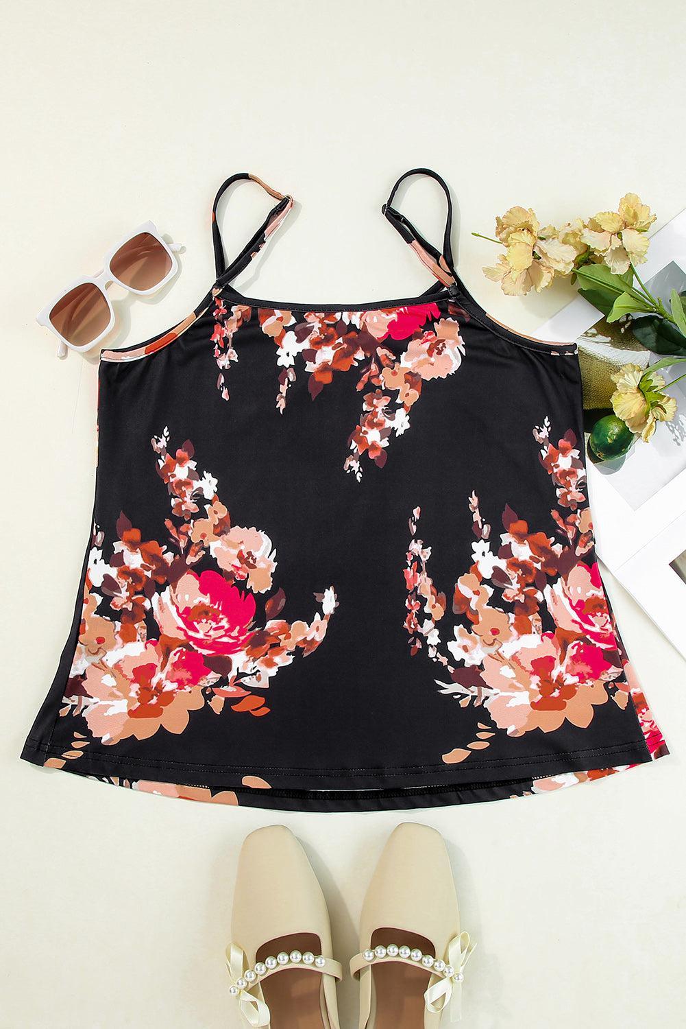 a black top with a floral print and a pair of white shoes