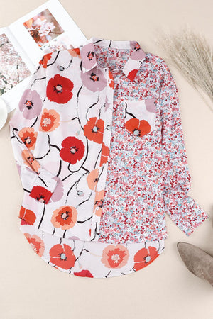 a white shirt with red flowers on it next to a pair of scissors and a