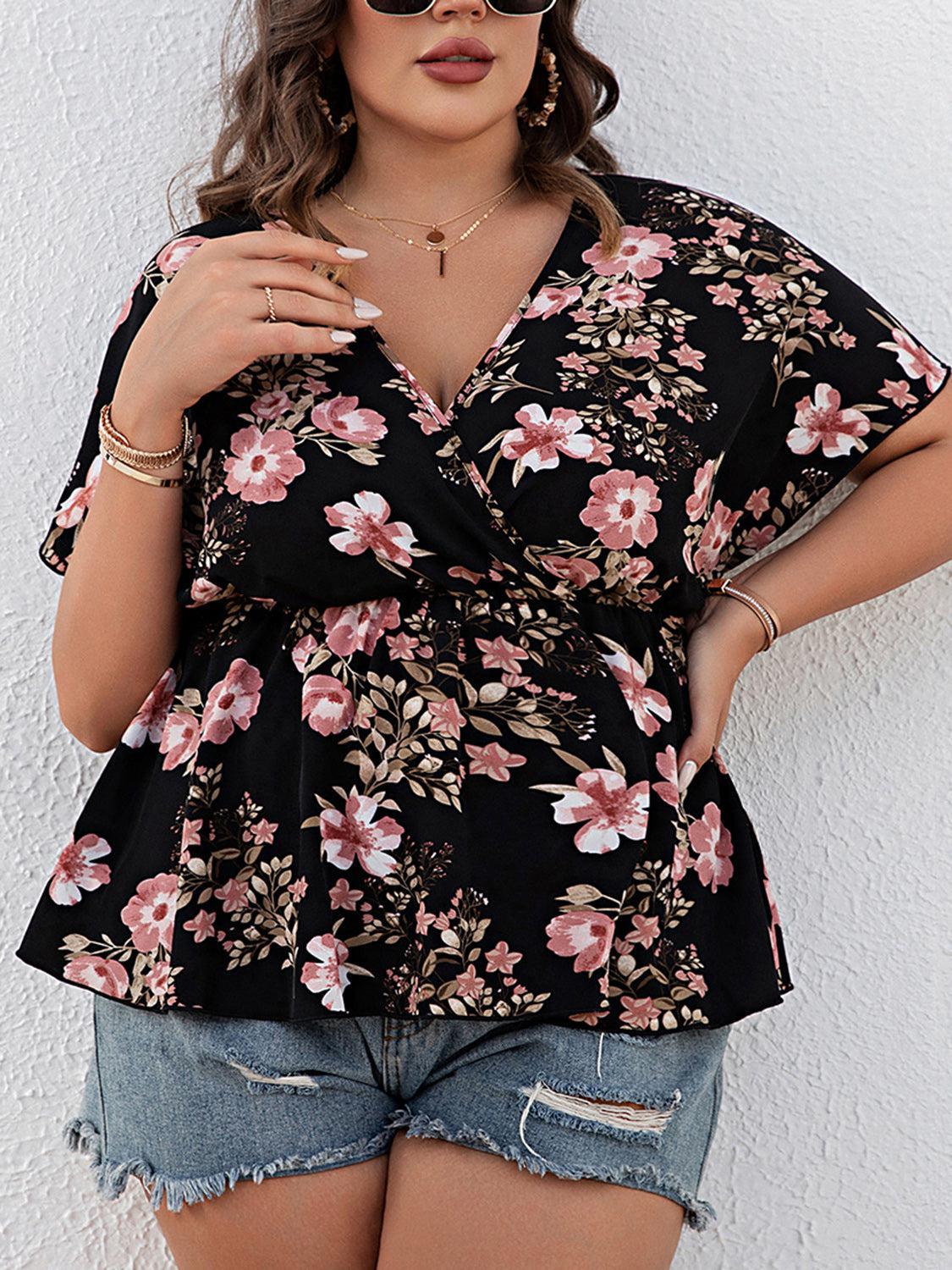 a woman in a floral top poses for a picture