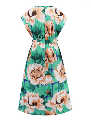 a green and orange floral print dress