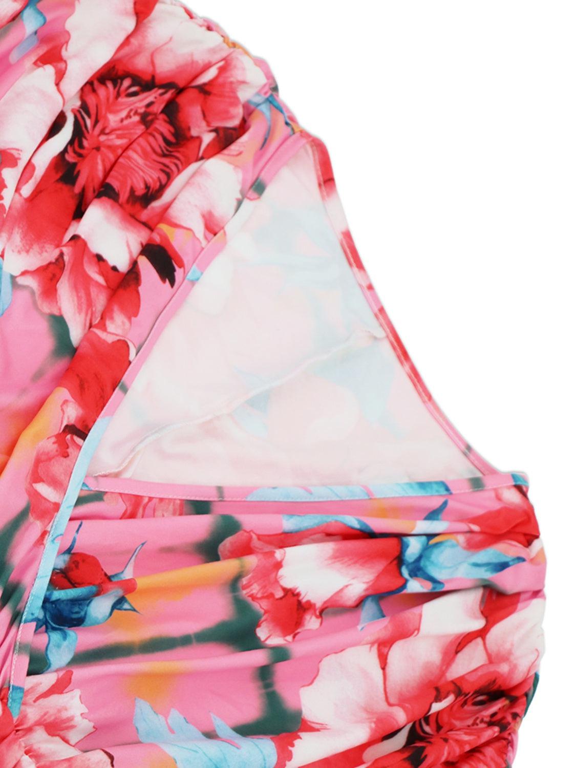 a close up of a pink and blue dress with flowers on it