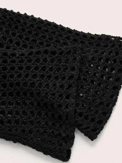 a close up of a black crocheted scarf