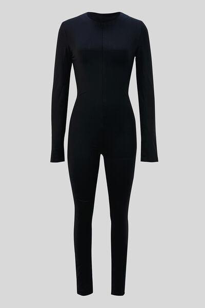 a black bodysuit with a high neck and long sleeves