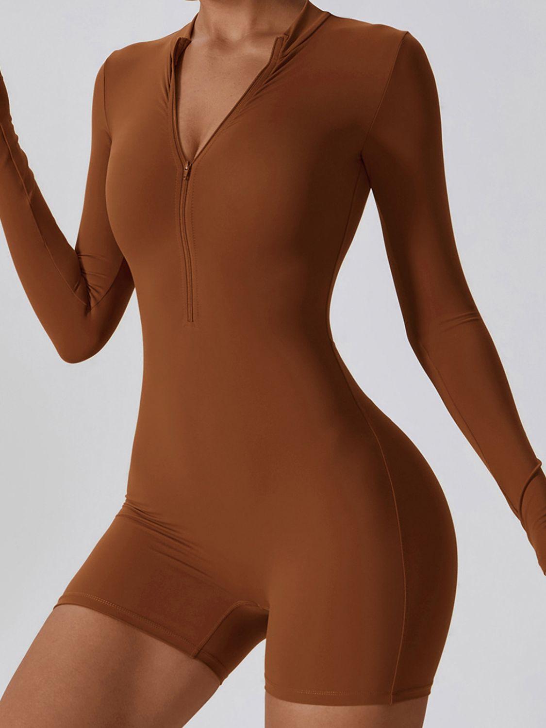 a woman in a brown bodysuit holding a cigarette
