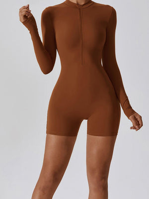 a woman wearing a brown bodysuit and high heels