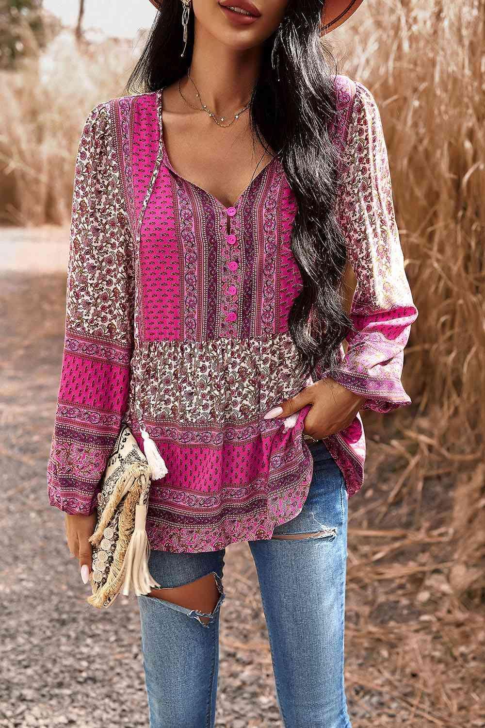 a woman wearing a pink top and ripped jeans