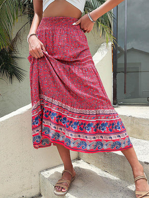 a woman in a skirt standing on steps