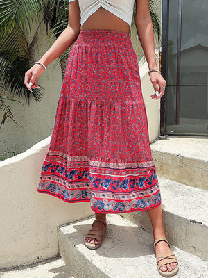 a woman in a skirt standing on some steps