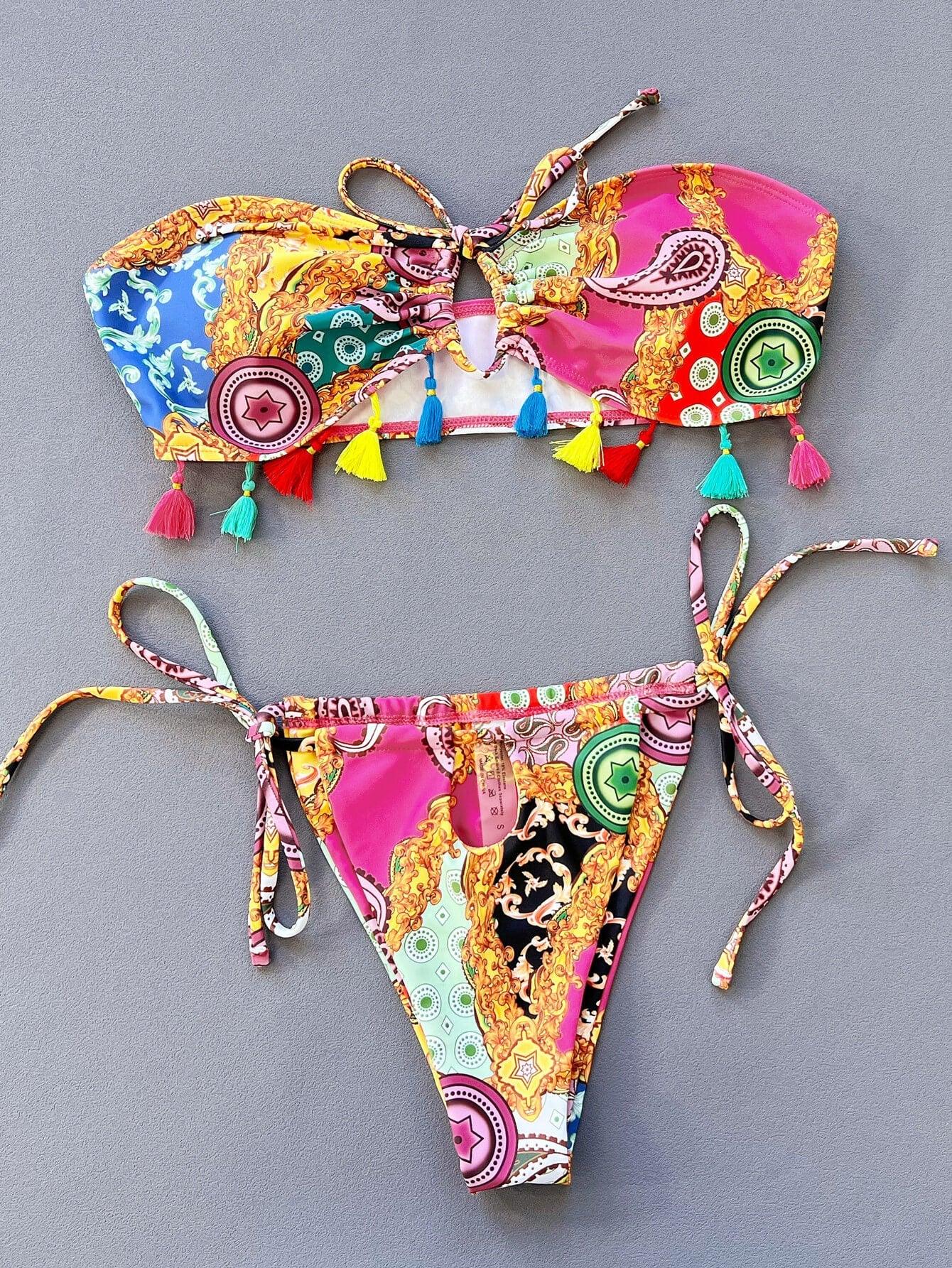 two pieces of colorful bikinis on a gray background