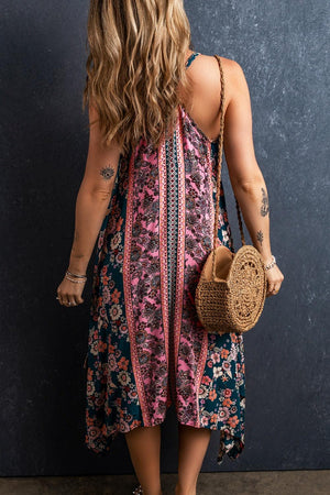 a woman in a floral dress holding a straw bag