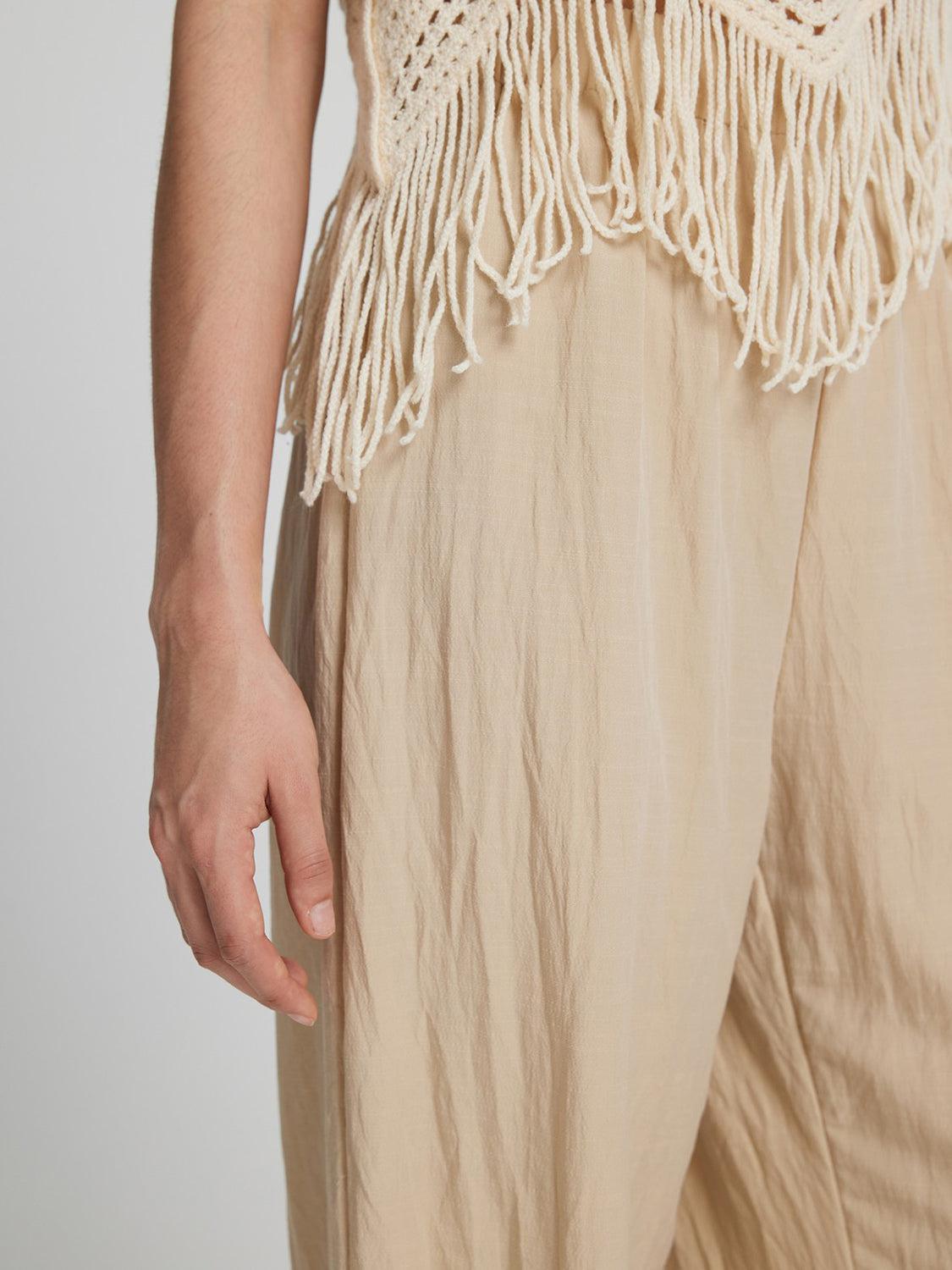 a close up of a person's pants with fringes