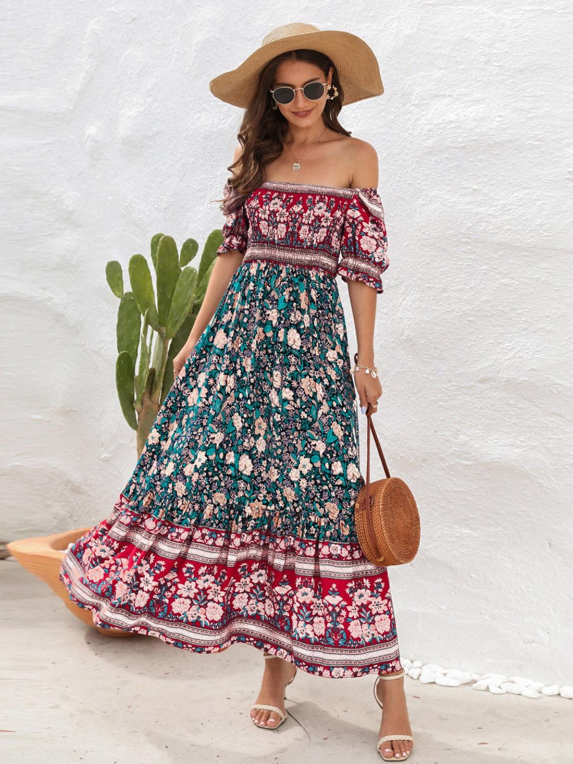 a woman wearing a floral dress and hat