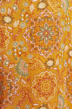 an orange and green floral print fabric