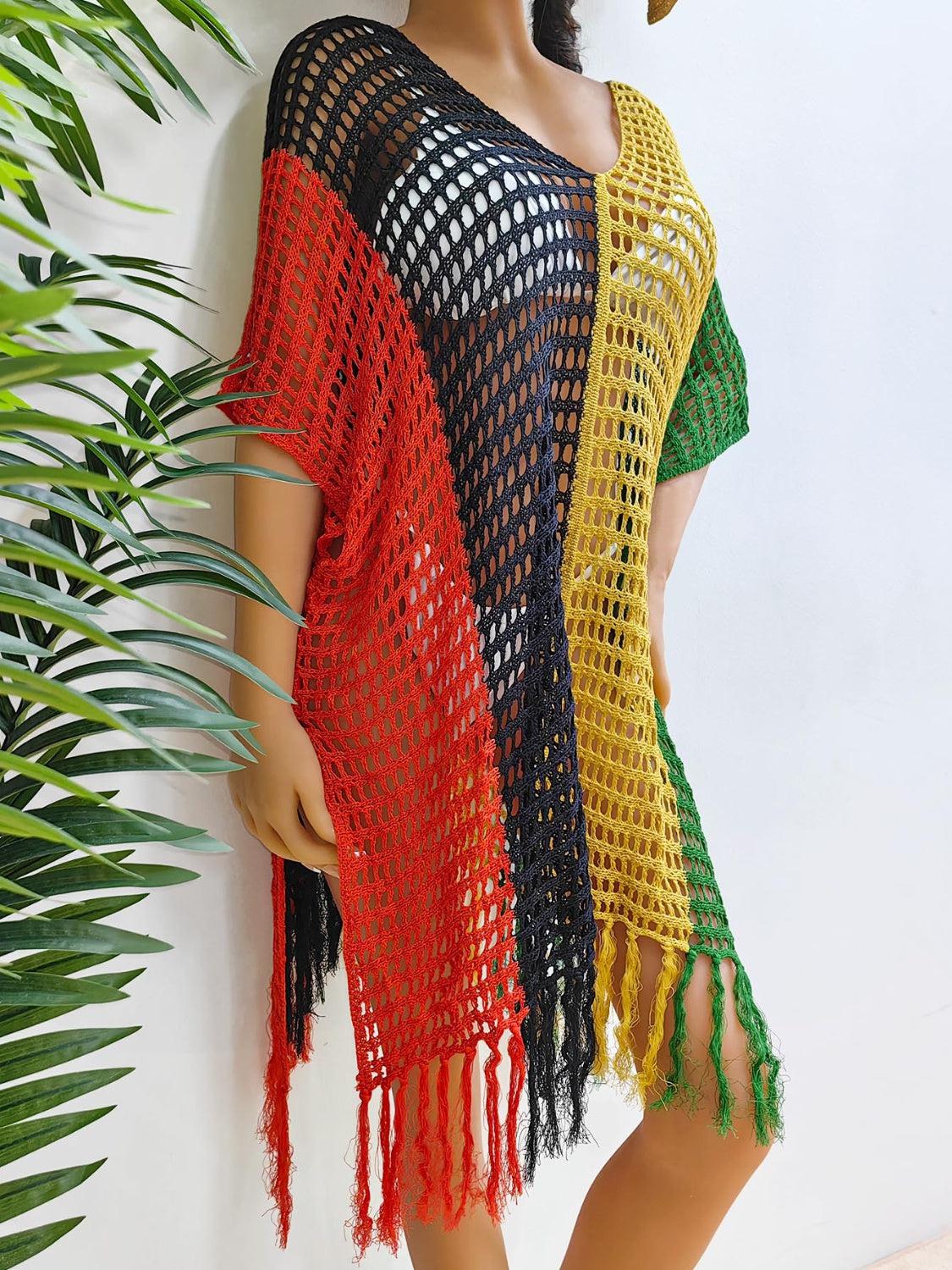 a mannequin wearing a colorful crochet shawl