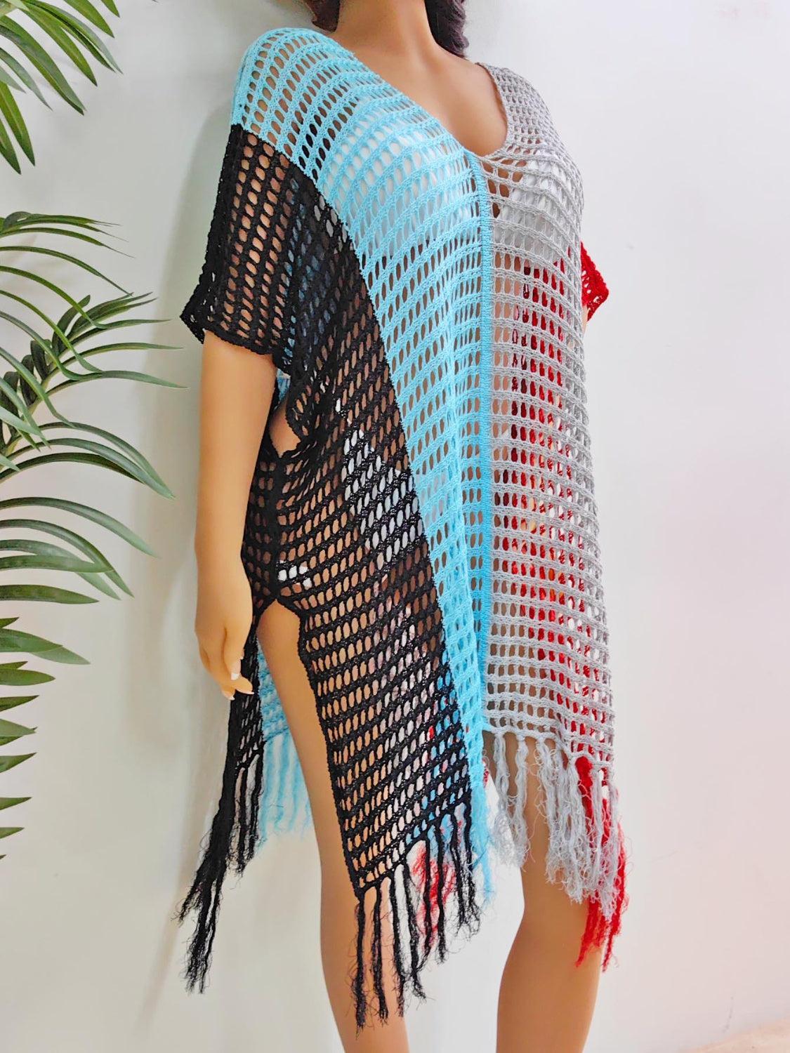 a woman wearing a crocheted shawl with a red, white and blue