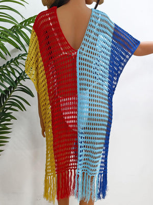 a mannequin wearing a colorful crochet shawl