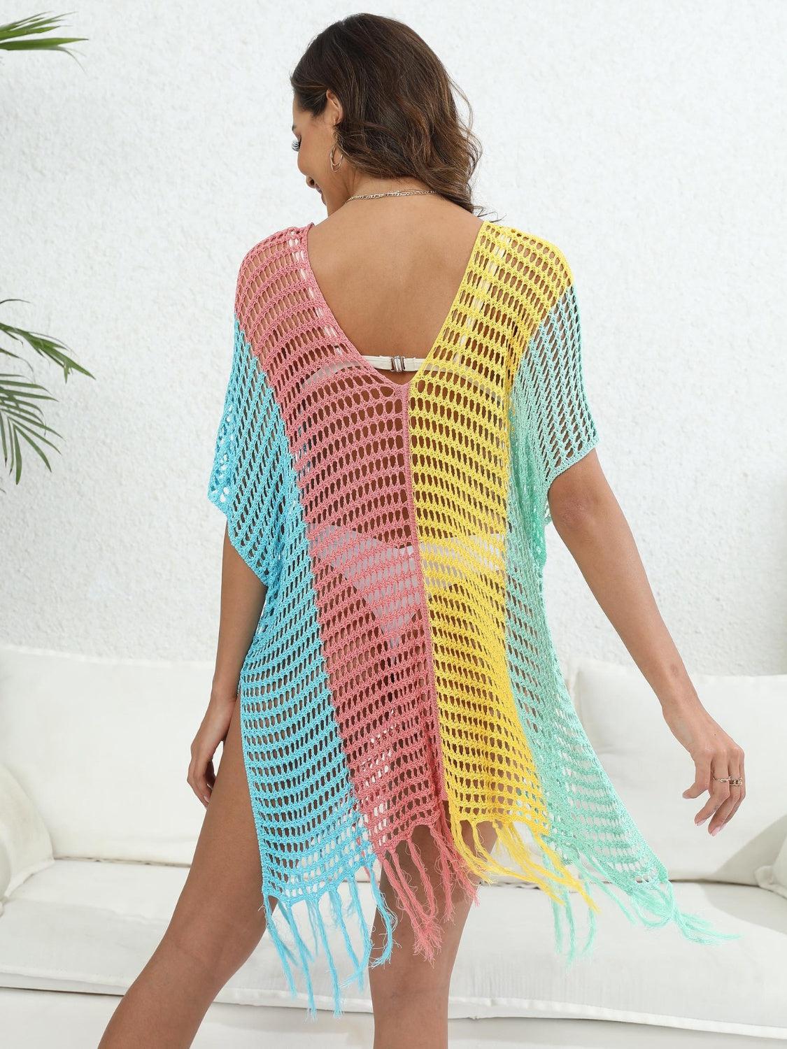 a woman wearing a colorful crochet cover up