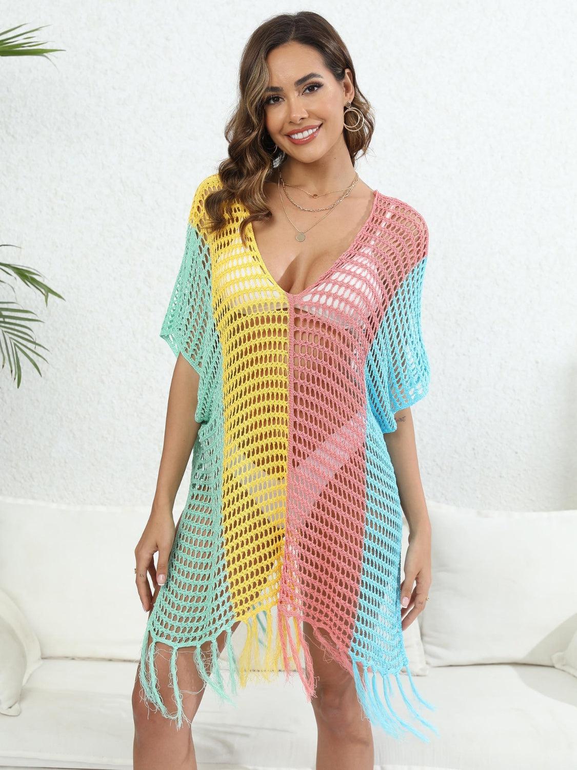 a woman wearing a colorful crochet cover up