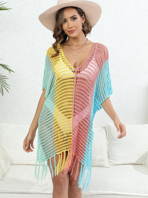 a woman wearing a colorful crochet cover up