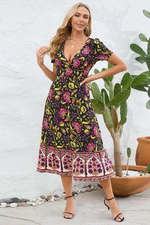 a woman standing in front of a potted plant