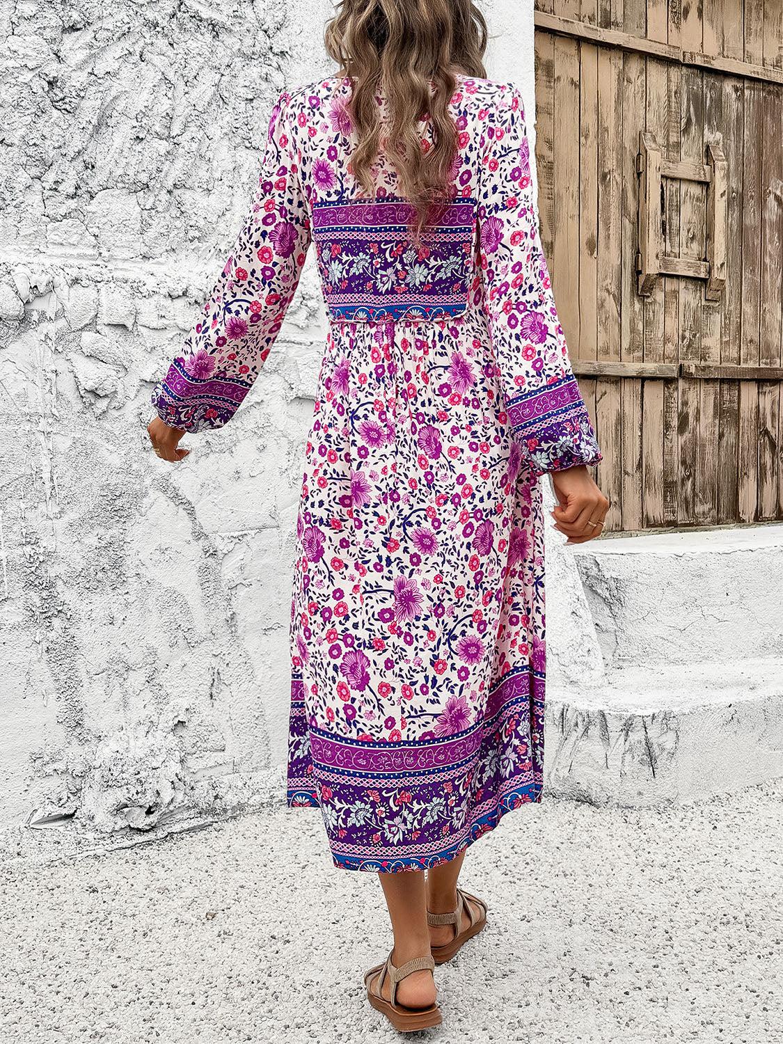 a woman in a floral print dress walking away from the camera