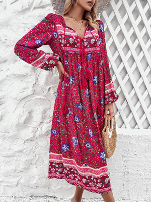 a woman wearing a red dress and a straw hat