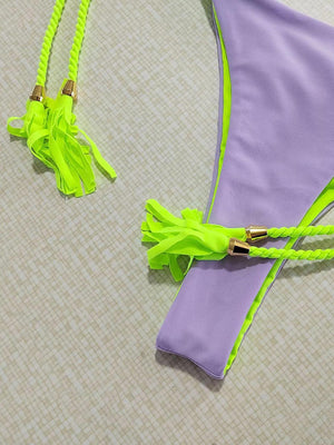 a pair of neon green and purple bras
