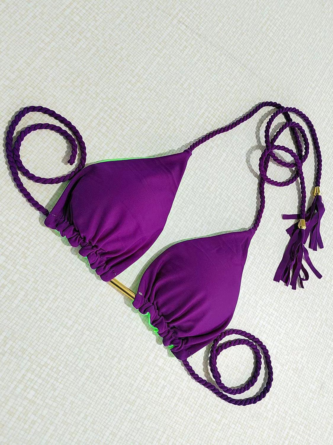 a purple bikini top with a tassel around the bottom