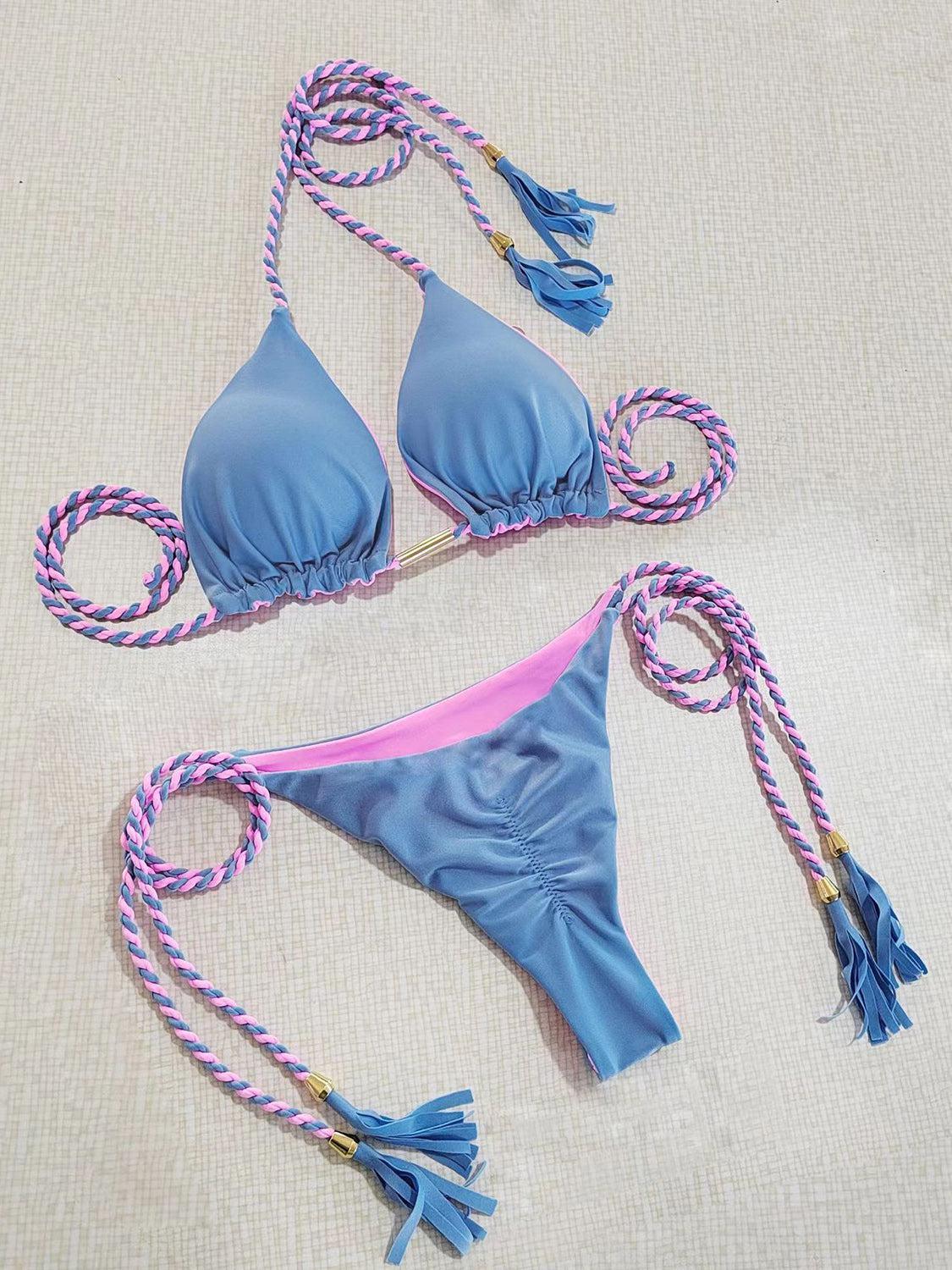 a blue bikini top and a pink and white string