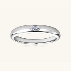 a white gold ring with a single diamond