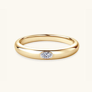 a yellow gold ring with a single diamond