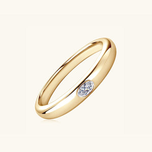 a yellow gold ring with a single diamond