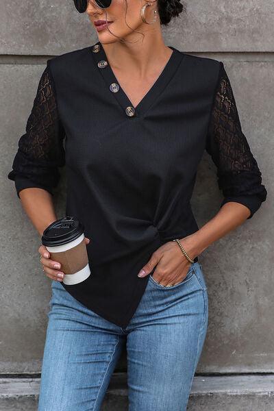 a woman holding a coffee cup and wearing a black top