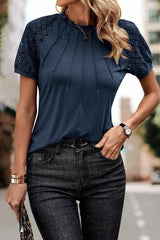 a woman wearing a blue top and jeans