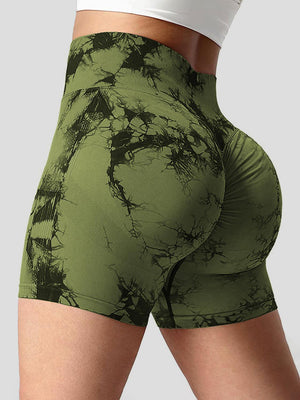 a woman's green shorts with a black and white pattern