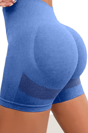 a woman in blue shorts with her butt showing