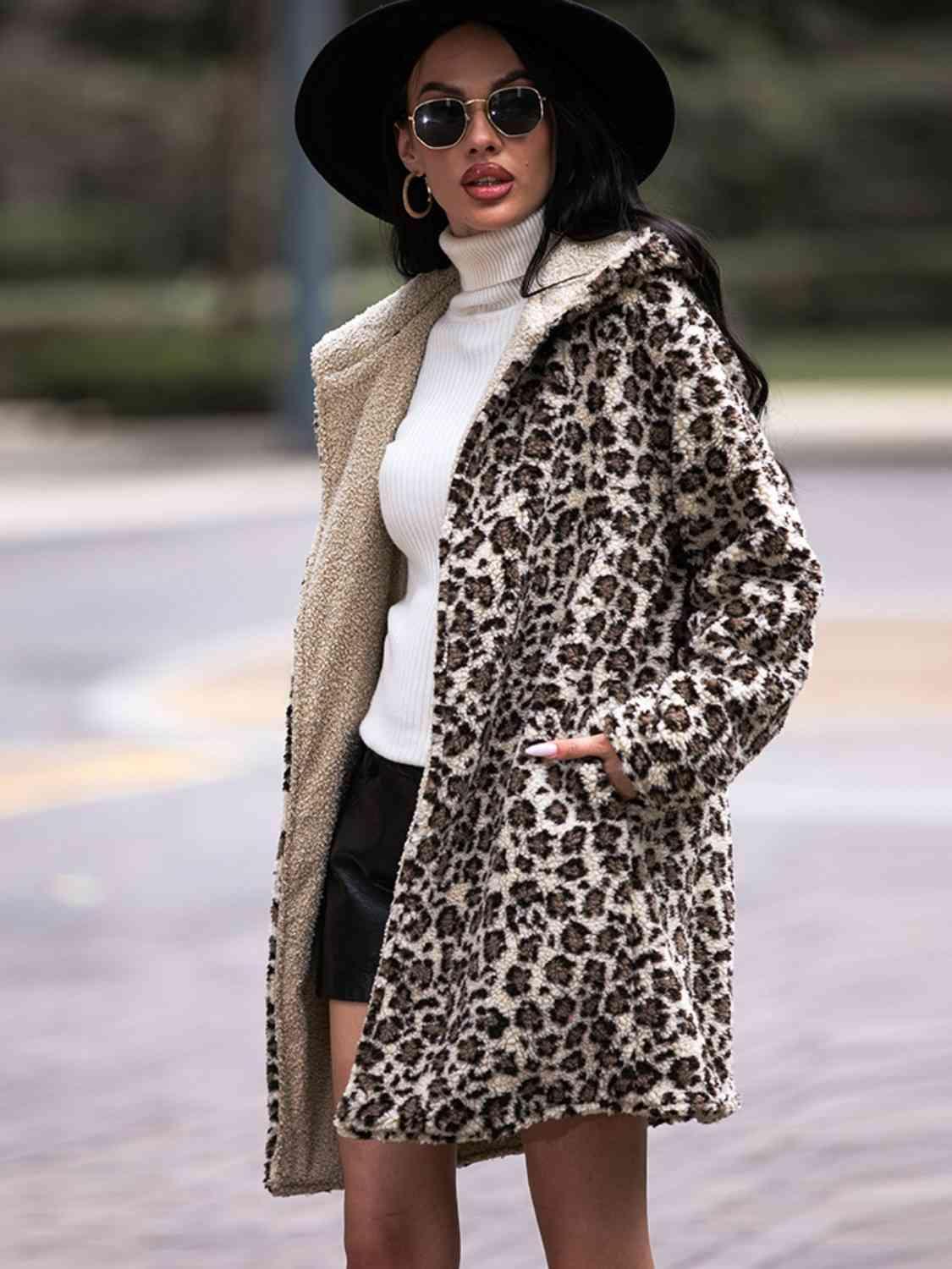 a woman in a leopard print coat and hat