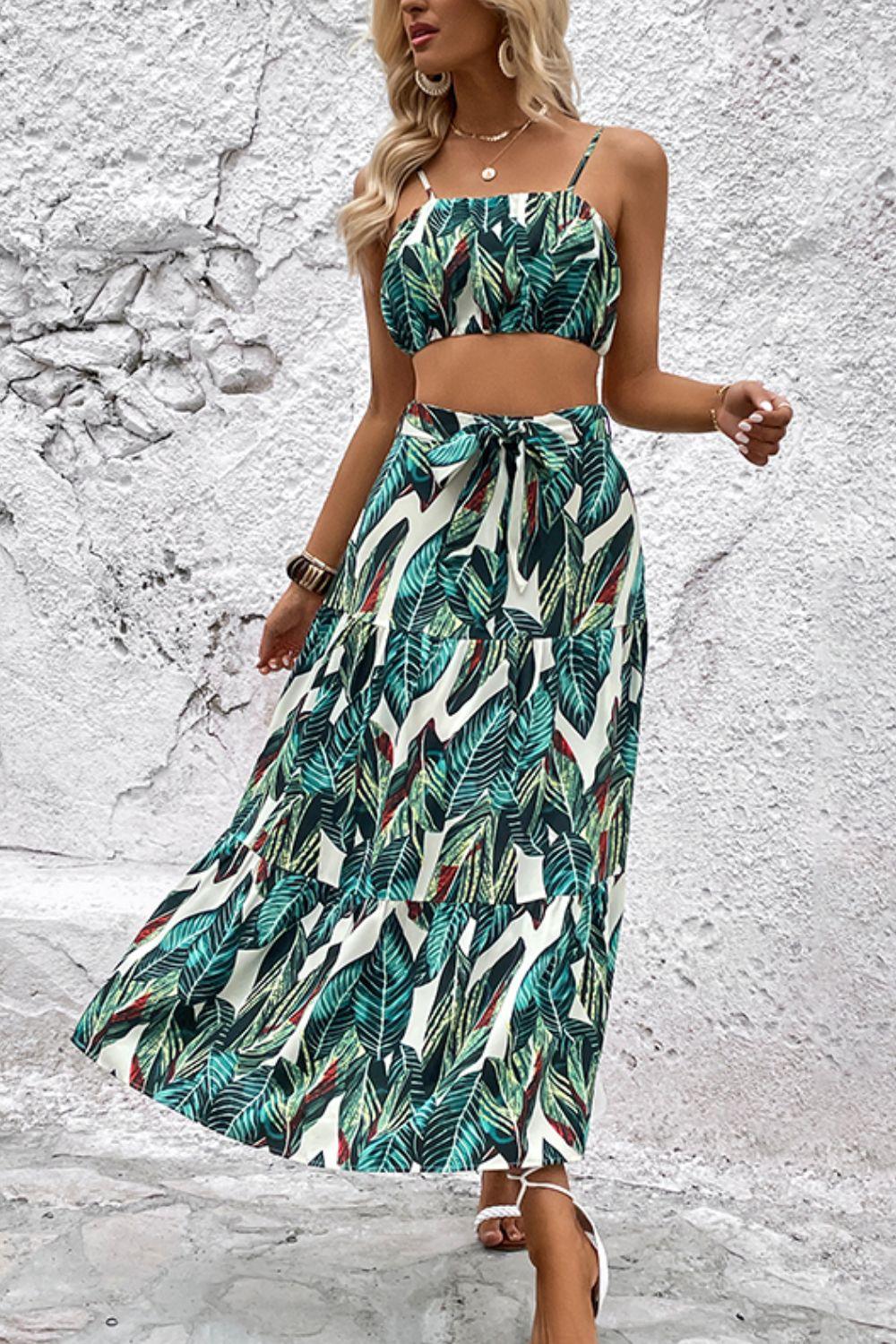 a woman in a tropical print dress