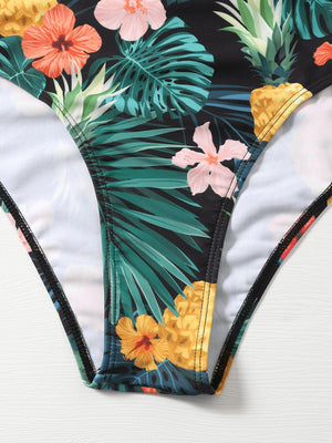 a women's bikini top with a tropical print